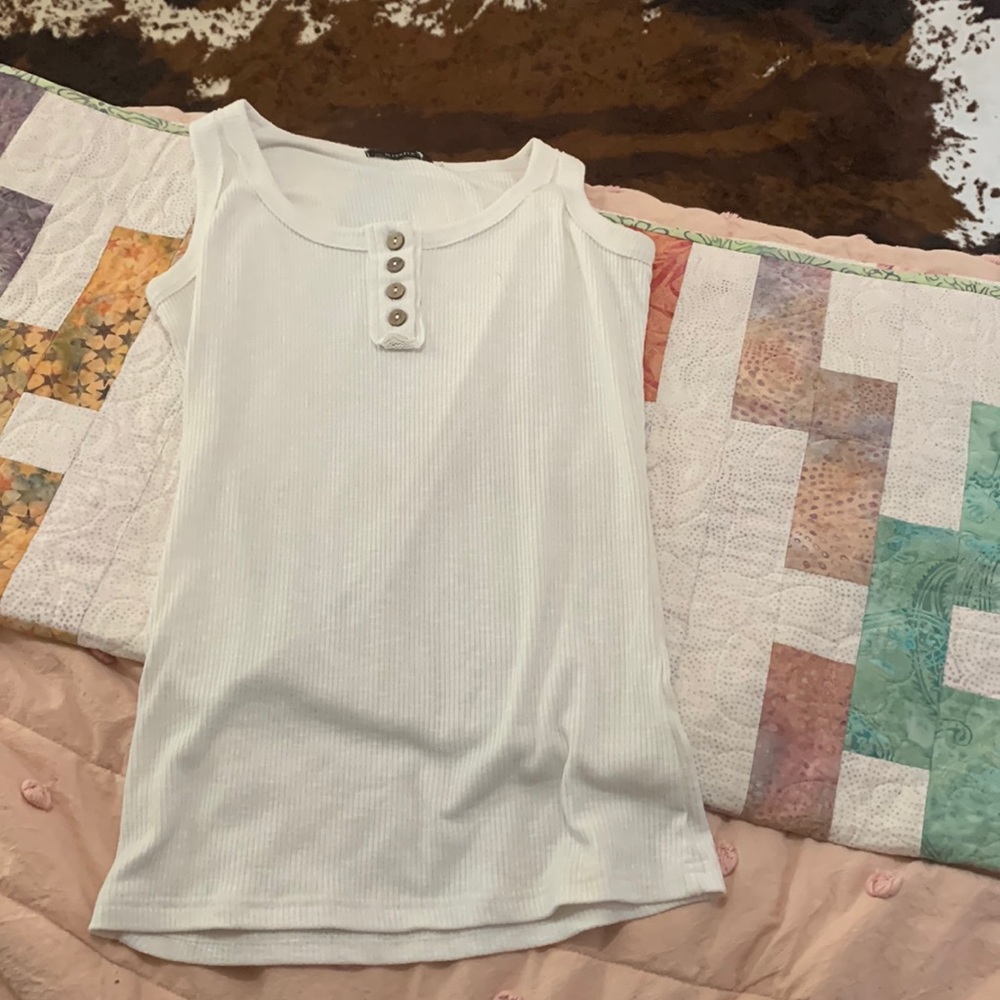 Basic white tank top goes with anything.